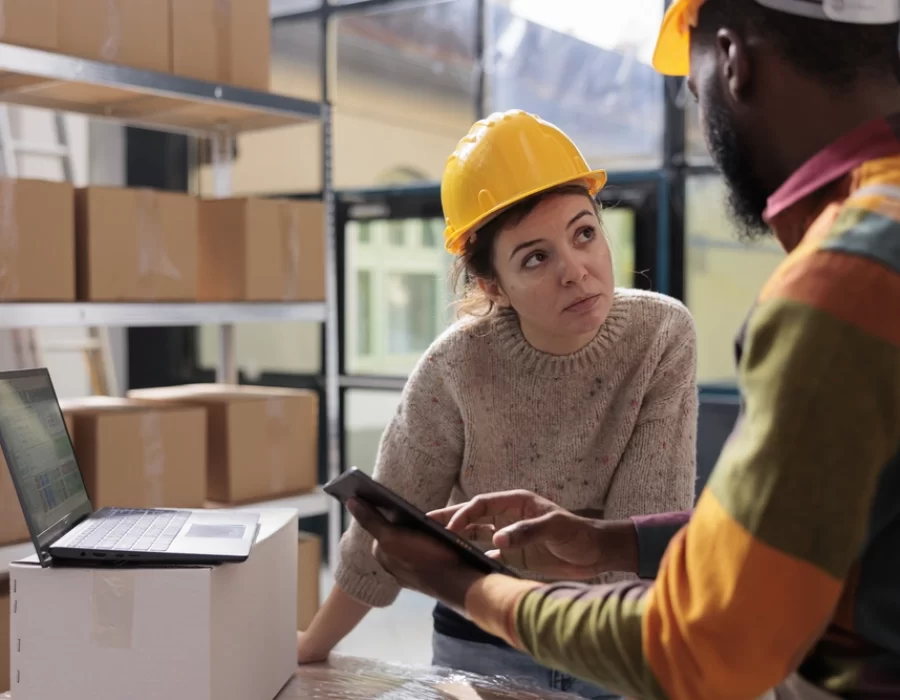 diverse-stockroom-team-checking-online-orders-tablet